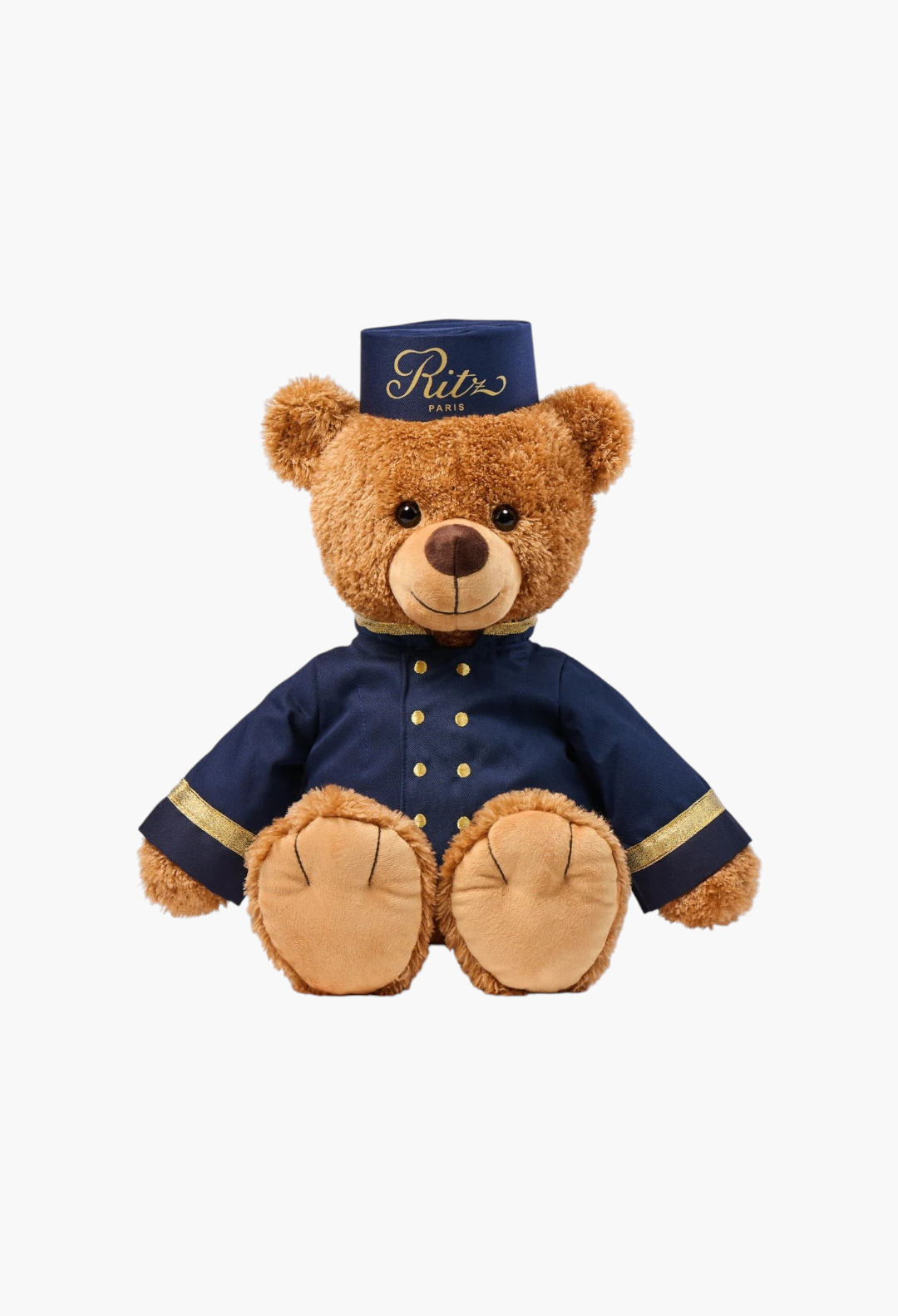 GLAM MODA 38cm teddy bear dressed in a navy blue Ritz Paris bellboy uniform with gold buttons and matching cap.