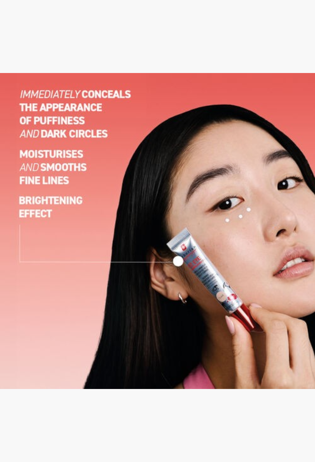 GLAM MODA Erborian CC Eye tinted cream tube held by a model to brighten and smooth the skin around the eyes
