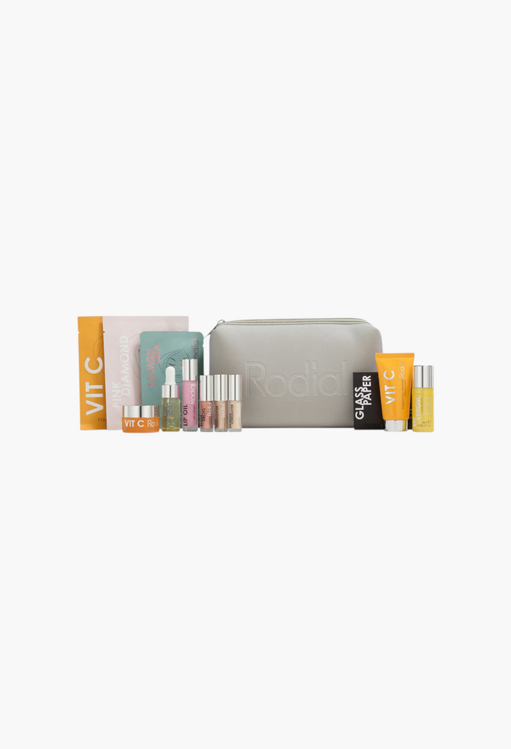 GLAM MODA 12 Days of Rodial Glow skincare and makeup advent calendar set with a grey travel bag and assorted products.