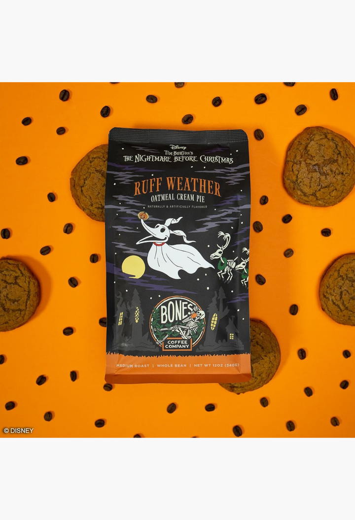 GLAM MODA Bones Coffee Company Nightmare Before Christmas coffee bag with oatmeal cream pie flavor on orange background