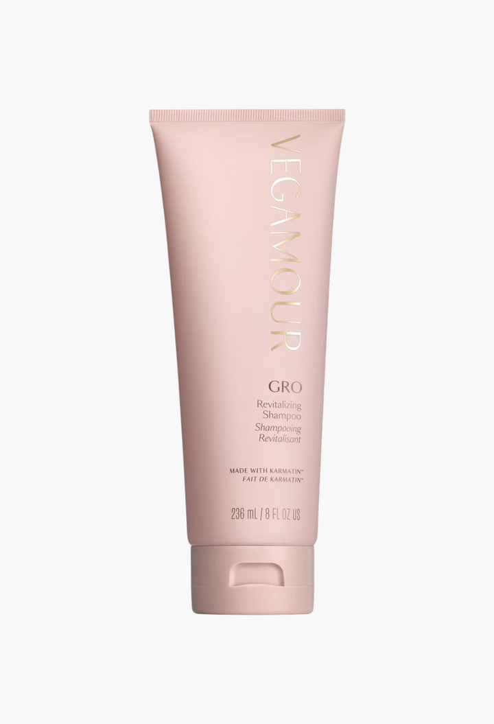 GLAM MODA GRO Revitalizing Shampoo in a pale pink squeeze tube for thinning hair, vegan and strengthening formula.