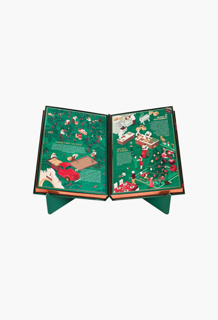 GLAM MODA Neuhaus chocolate book advent calendar with festive green illustrations of cocoa harvesting and production.