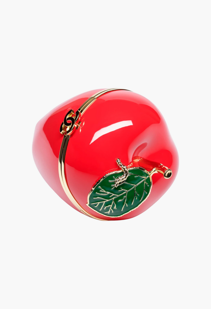 GLAM MODA apple-shaped minaudiere in red lacquered metal with a green enamel leaf and gold-tone metal details.