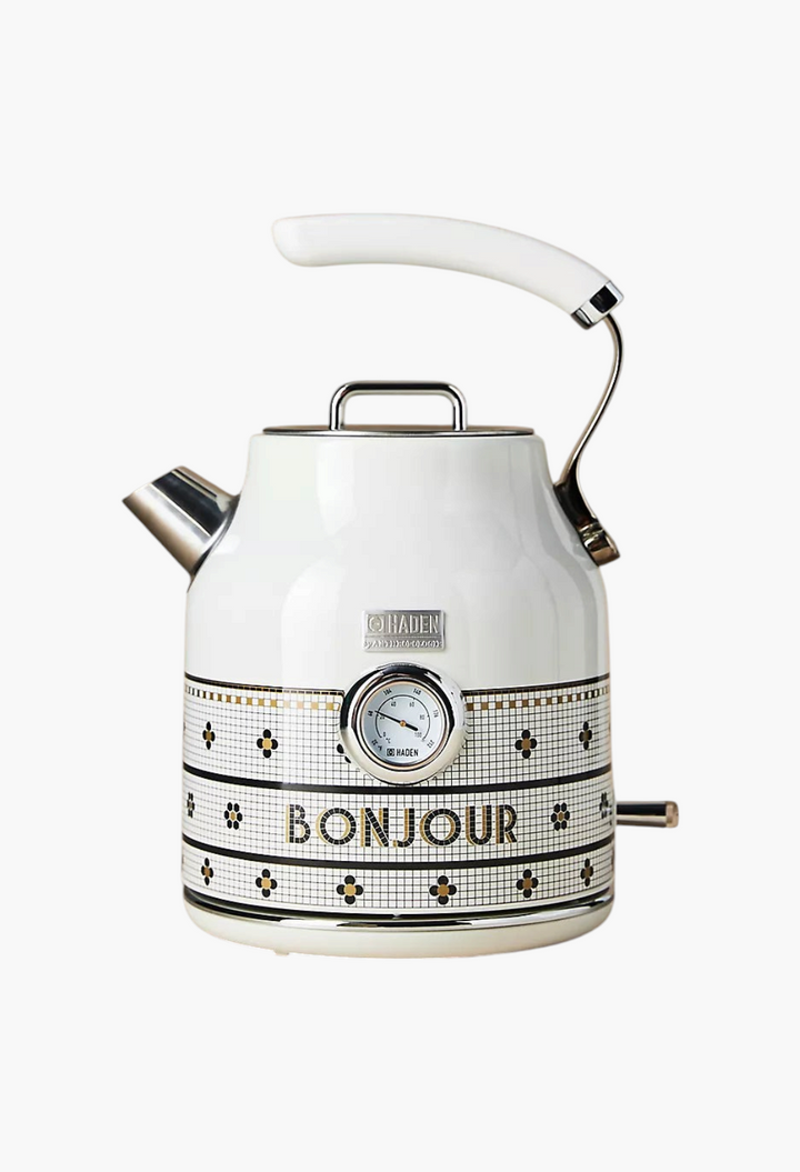 GLAM MODA Bistro Tile electric kettle by Haden in white with 24k gold accents and Bonjour text on a neutral background