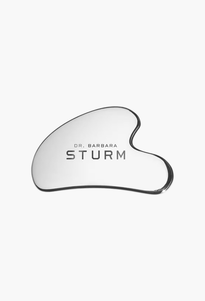GLAM MODA Dr. Barbara Sturm silver metal gua sha tool for facial massage and skin elasticity