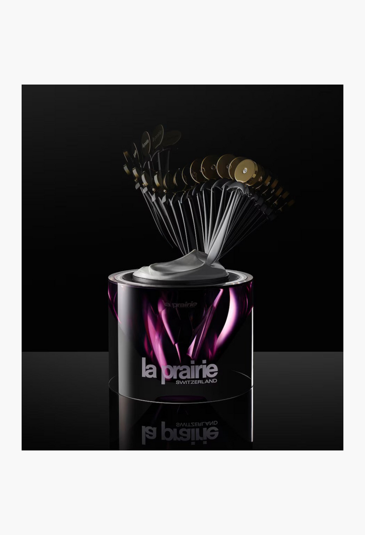 GLAM MODA La Prairie Platinum Rare Haute-Rejuvenation Cream in a sleek purple jar with a fan of application spatulas.