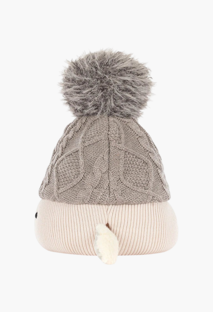 GLAM MODA Amuseables Pomilly plush toy featuring a grey cable-knit hat with a fluffy pom-pom and cream base.
