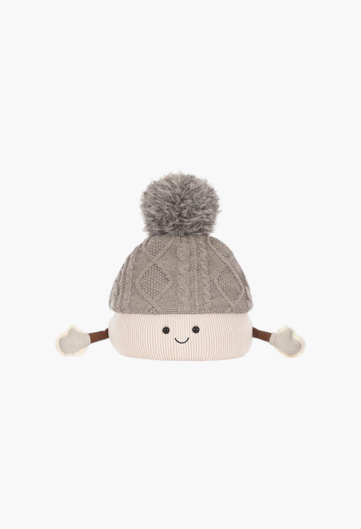 GLAM MODA Amuseables Pomilly plush toy featuring a grey cable-knit hat with a fluffy pom-pom and cute smiling face.