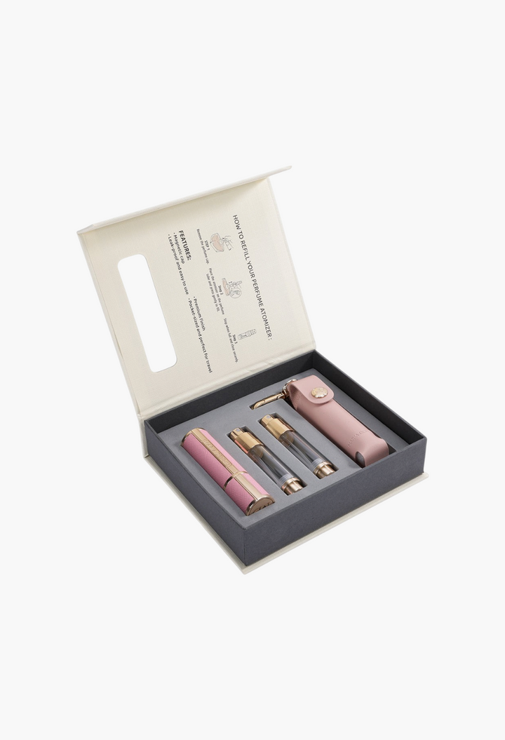 GLAM MODA refillable perfume atomizer set in dusty pink with travel case, glass vials, and instructional gift box.