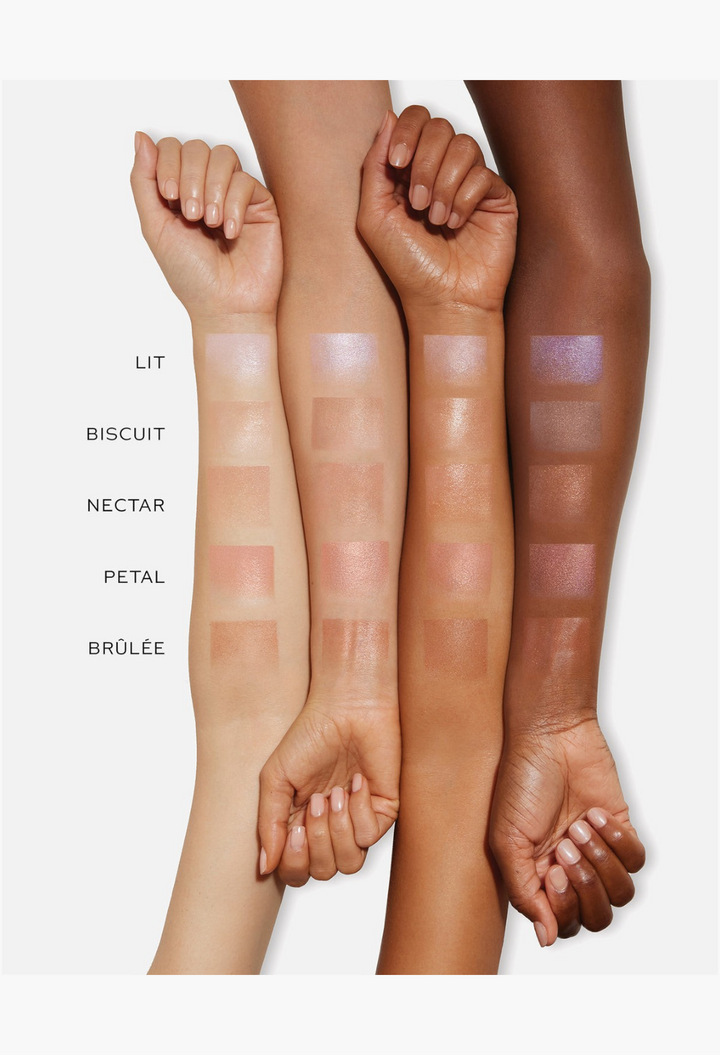 GLAM MODA Lit Up Highlight Stick swatches on four different skin tones showing radiant, glassy finish and shades.