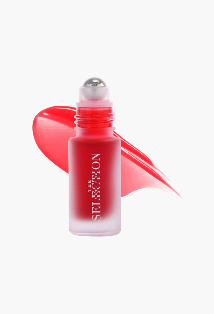 GLAM MODA The Artists Selection strawberry roll-on lip tint in a frosted glass bottle with a red liquid swatch