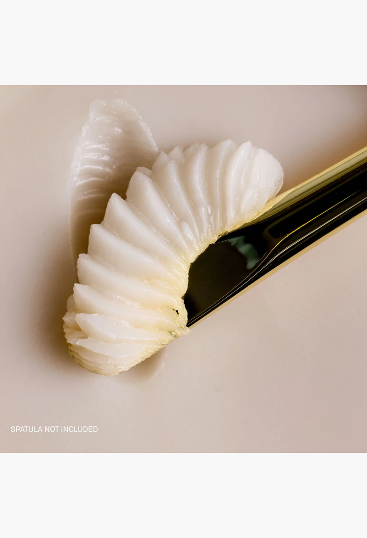 GLAM MODA Le Balm unscented solid serum texture on a gold applicator for sensitive skin recovery