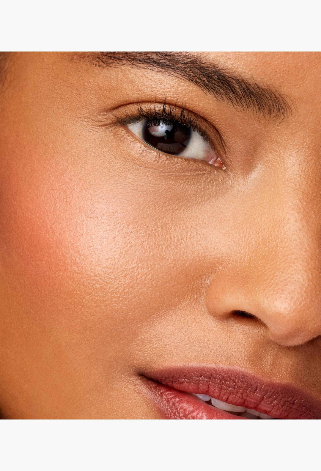 GLAM MODA Baby Cheeks Blush Stick applied to model cheekbones for a natural flushed look with creamy pigment