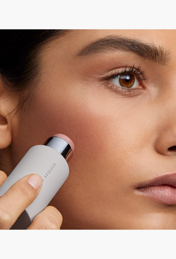 GLAM MODA Baby Cheeks Blush Stick being applied to a model's cheek for a natural, flushed-from-within glow.