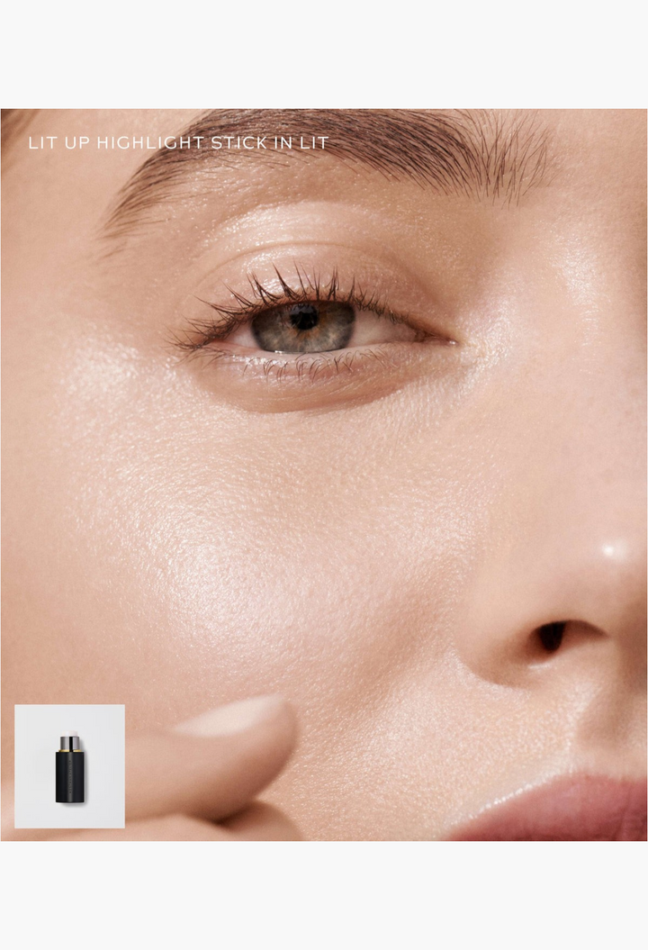 GLAM MODA Lit Up Highlight Stick applied to skin for a radiant glassy finish with a soft natural glow