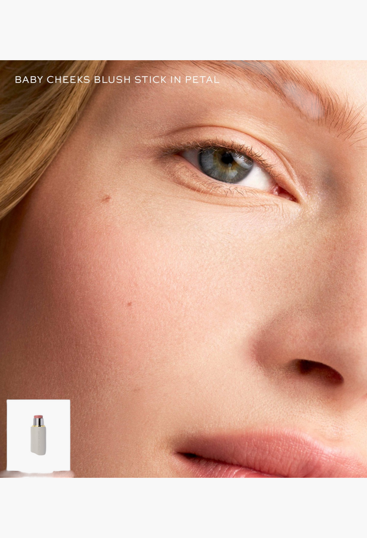 GLAM MODA Baby Cheeks Blush Stick in Petal applied to a model's cheek for a natural, hydrating flush of color.