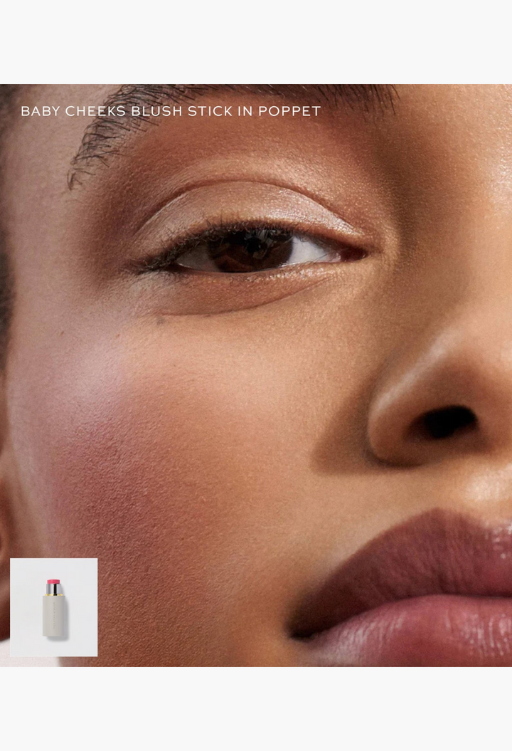 GLAM MODA Baby Cheeks Blush Stick in Poppet applied to a model's cheek and lips for a natural, healthy flush.