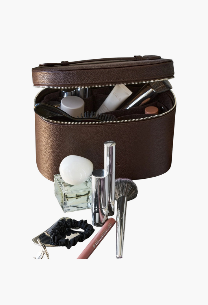 GLAM MODA brown vegan leather beauty case with interior organizer filled with makeup brushes and cosmetics