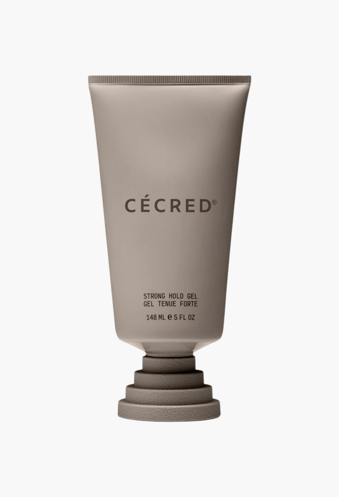 GLAM MODA CÉCRÉD Strong Hold Gel in a beige squeeze tube with a unique tiered base against a black background.