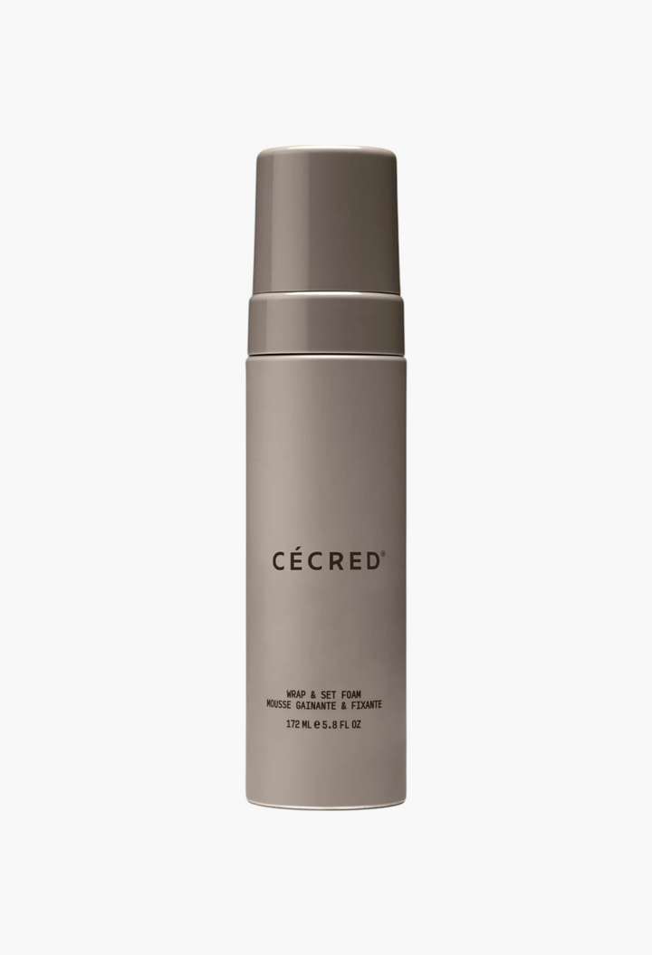 GLAM MODA Wrap & Set Foam in a sleek beige pump bottle for frizz control, heat protection, and styling.