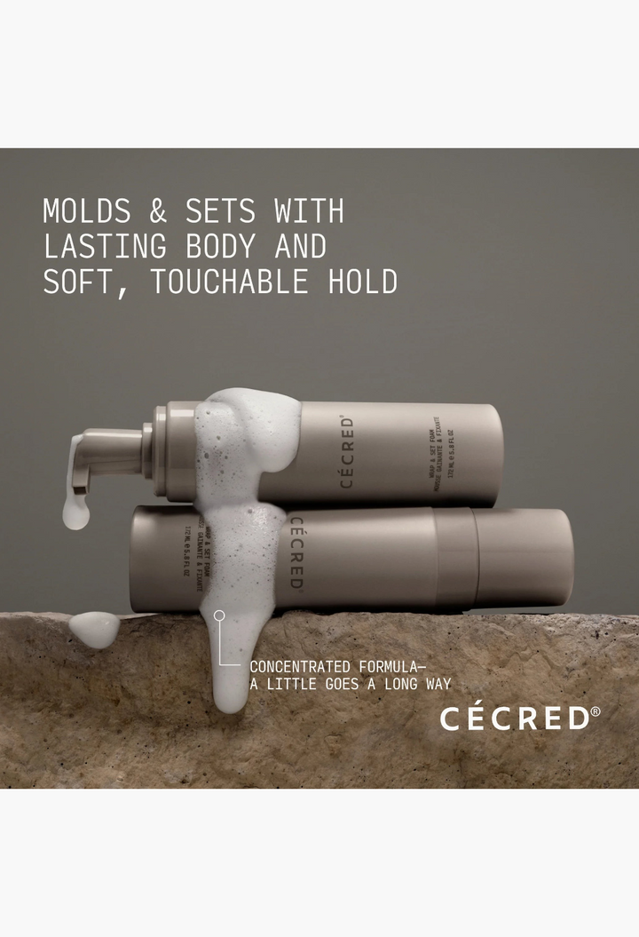 GLAM MODA CÉCRÉD Wrap & Set Foam bottles with white conditioning foam on a stone surface for hair styling.