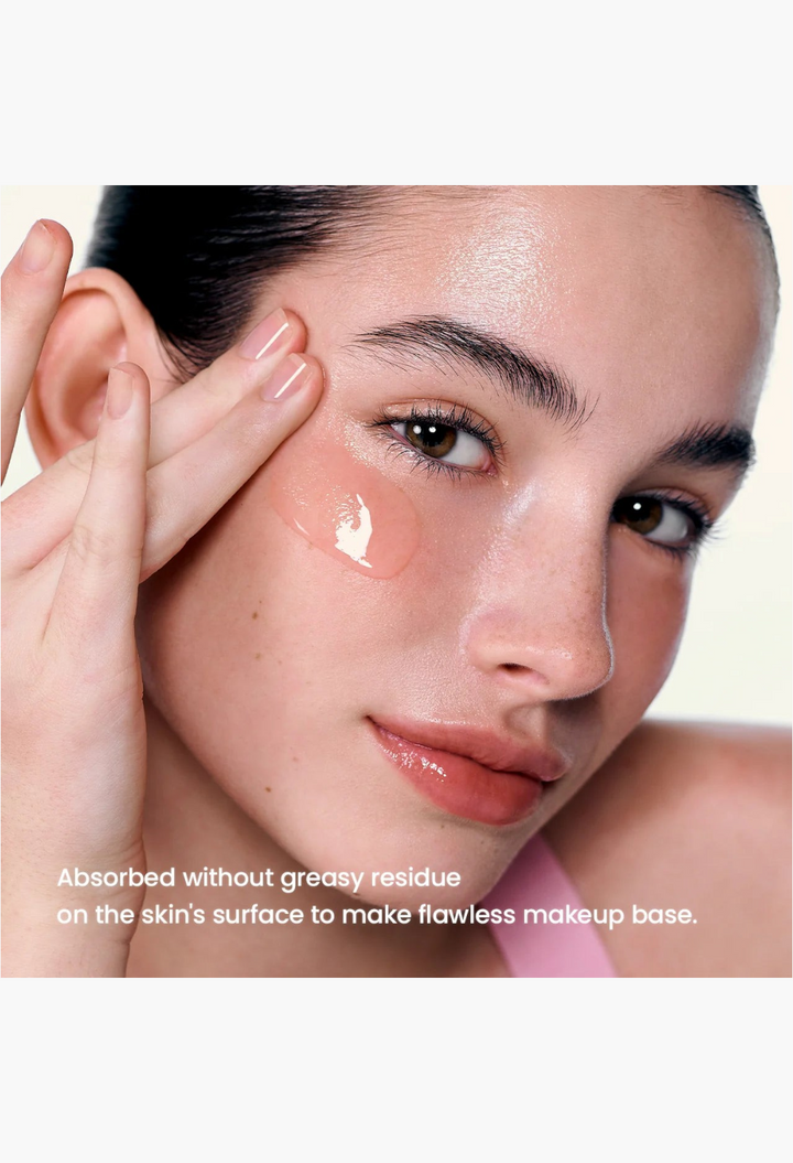 GLAM MODA Pore Perfecting Collagen Peptide Serum being applied to a model's cheek for smooth, firm skin.