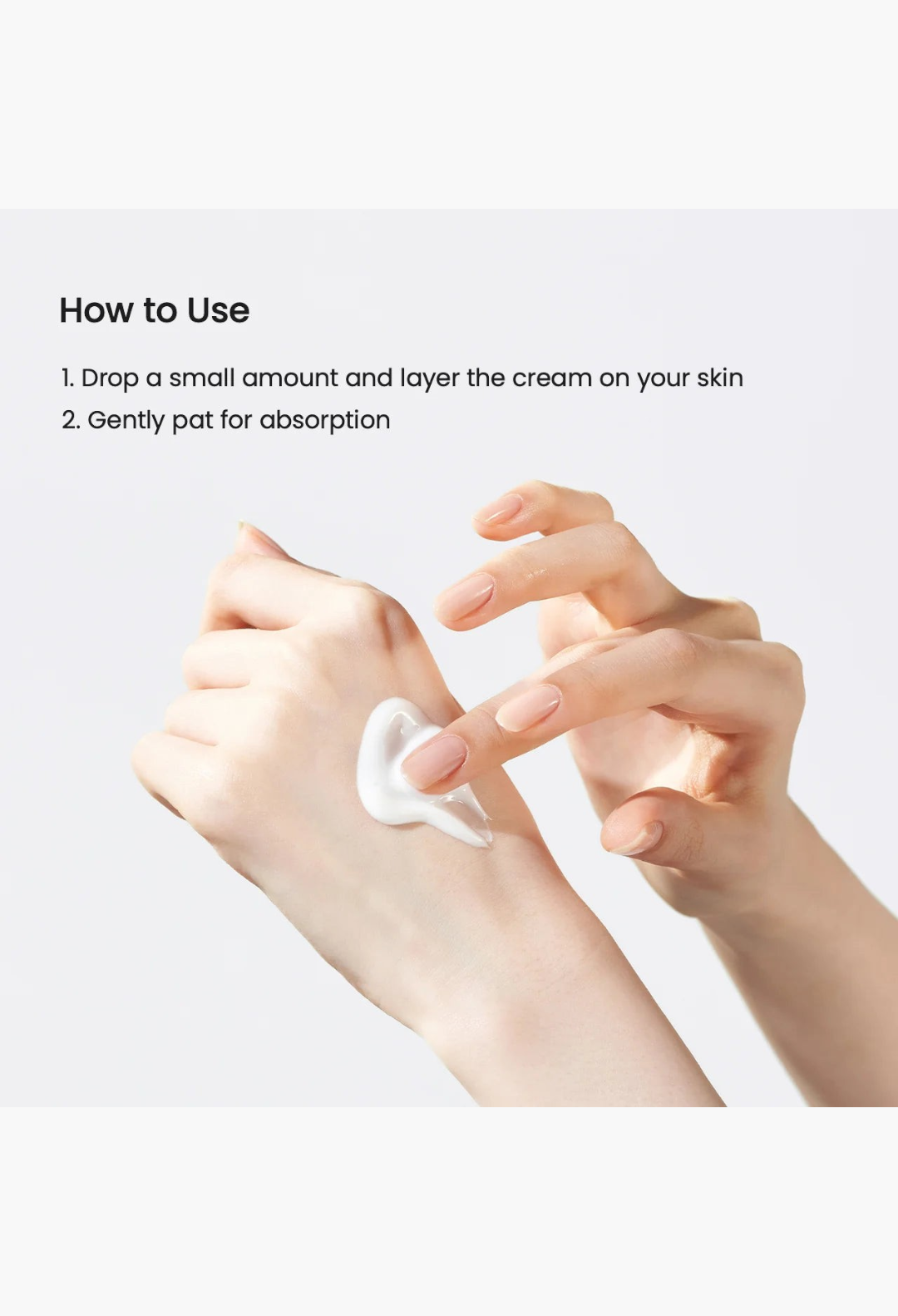 GLAM MODA Skin Glow Essence Cream being applied to hand, showing the lightweight white hydrating facial cream texture