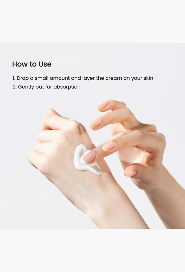 GLAM MODA Skin Glow Essence Cream being applied to hand, showing the lightweight white hydrating facial cream texture