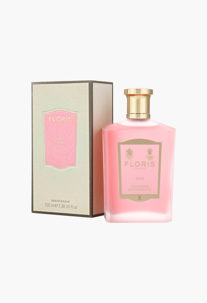 GLAM MODA Rose mouthwash in a frosted glass bottle with a gold cap next to its elegant beige and pink product box.