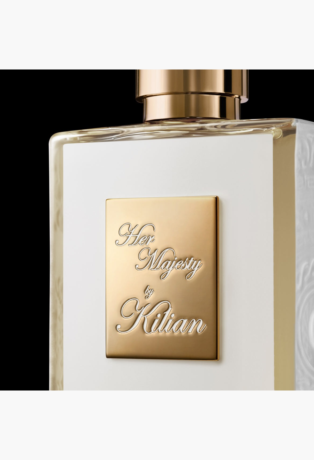 GLAM MODA Her Majesty Eau de Parfum bottle featuring a gold plaque on a white glass surface against a black background