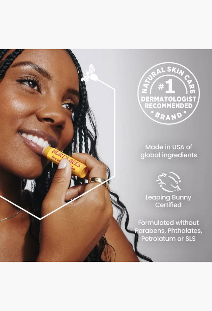 GLAM MODA Burt's Bees tinted lip balm applied by a smiling woman with braids for hydrated and soft lips