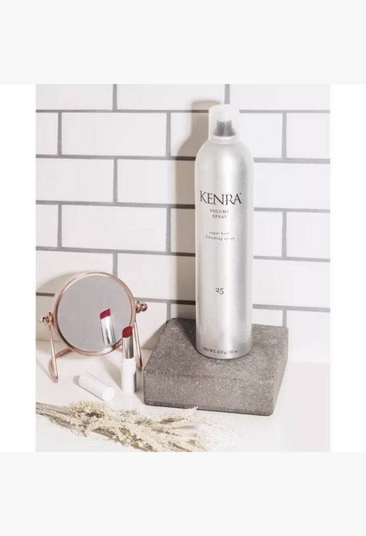 GLAM MODA Kenra Volume Spray 25 super hold finishing spray in a silver aerosol can on a stone pedestal