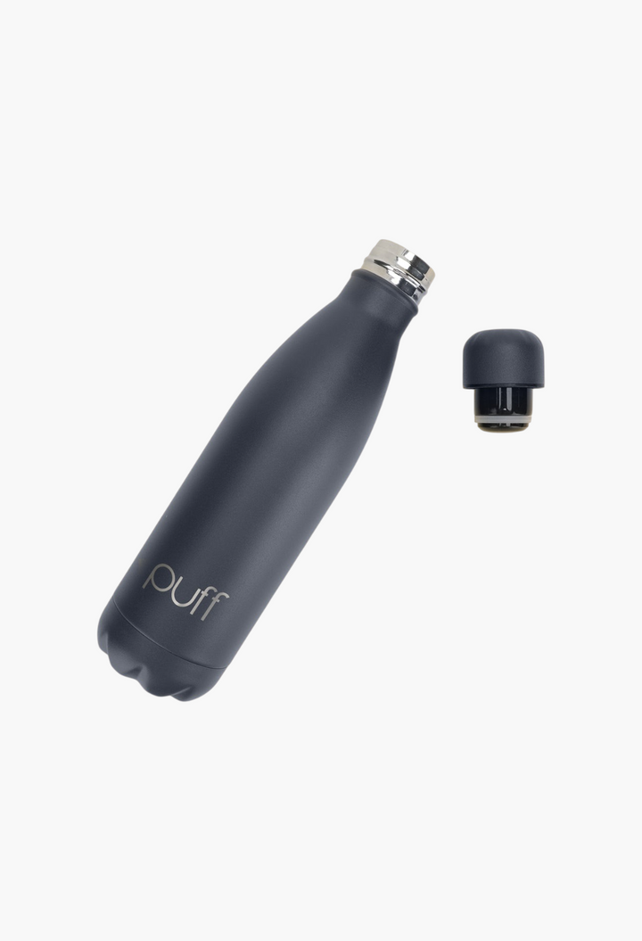 GLAM MODA matte Mykonos blue stainless steel insulated Puff bottle with open cap on a white background.