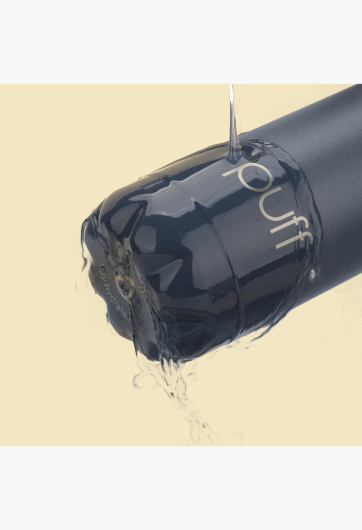 GLAM MODA matte Mykonos blue Puff Bottle with water cascading over the stainless steel surface