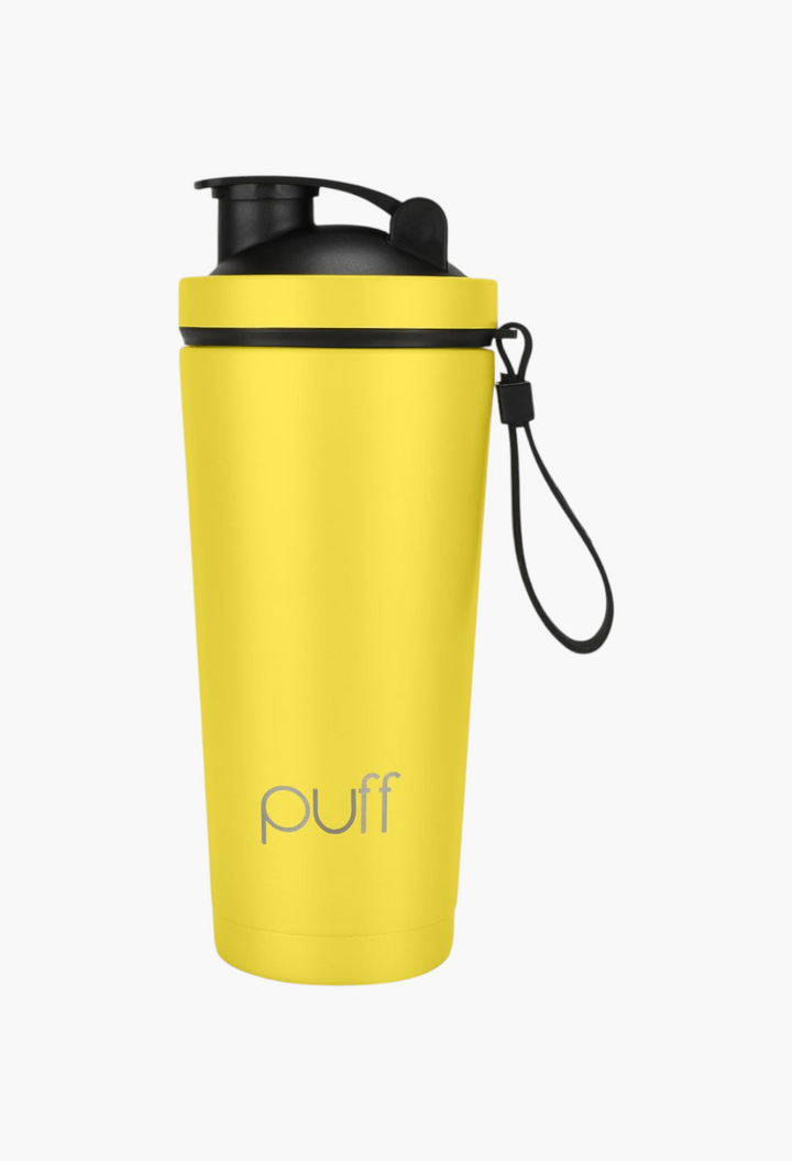 GLAM MODA yellow stainless steel insulated shaker bottle with a black vacuum-seal cap and carrying loop.