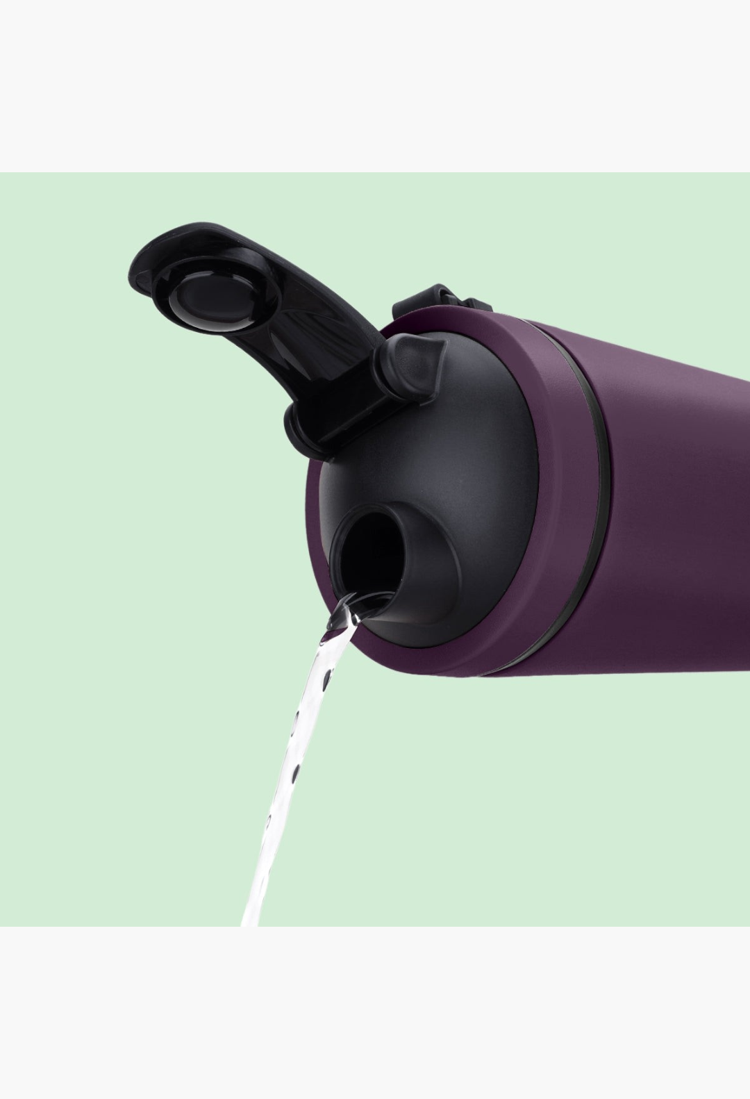 GLAM MODA Matte Shaker in deep purple stainless steel pouring water from its vacuum-seal cap