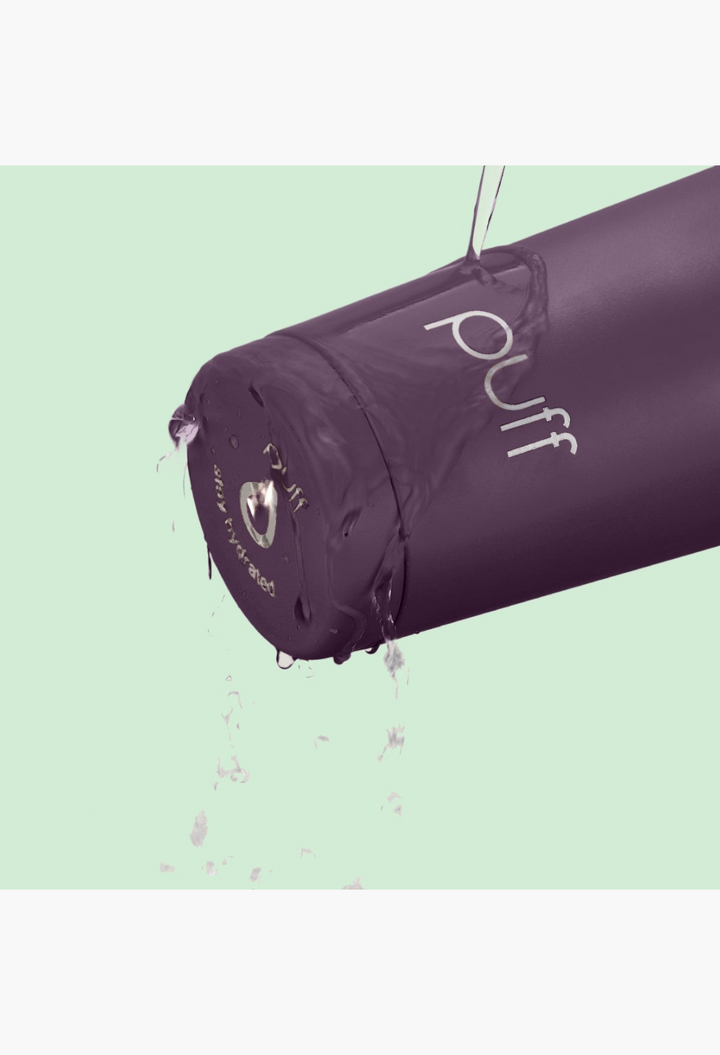 GLAM MODA Matte Shaker in deep purple stainless steel with water splashing over the vacuum-seal cap