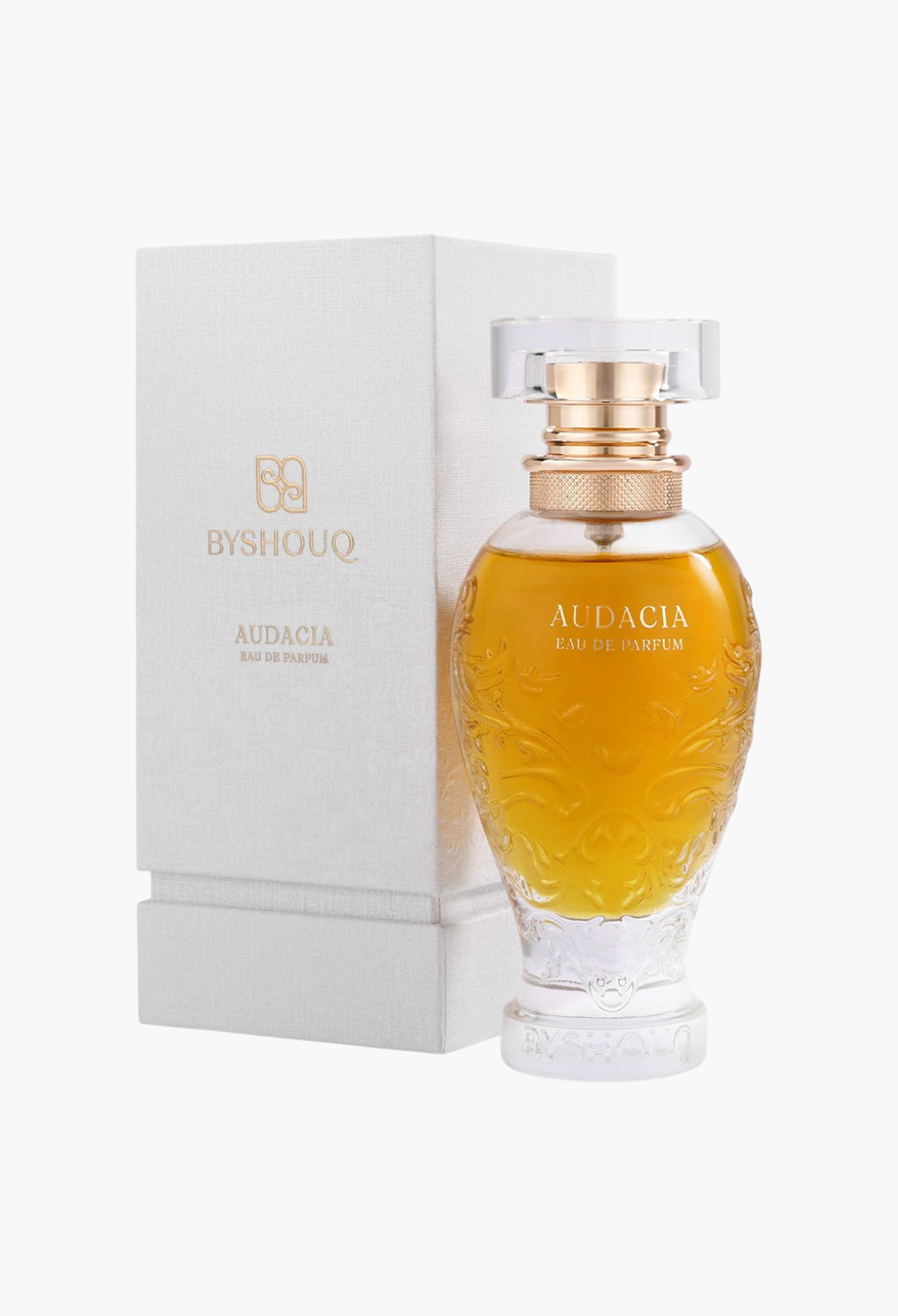 GLAM MODA Audacia woody eau de parfum in an ornate glass bottle with gold accents next to its white textured box.
