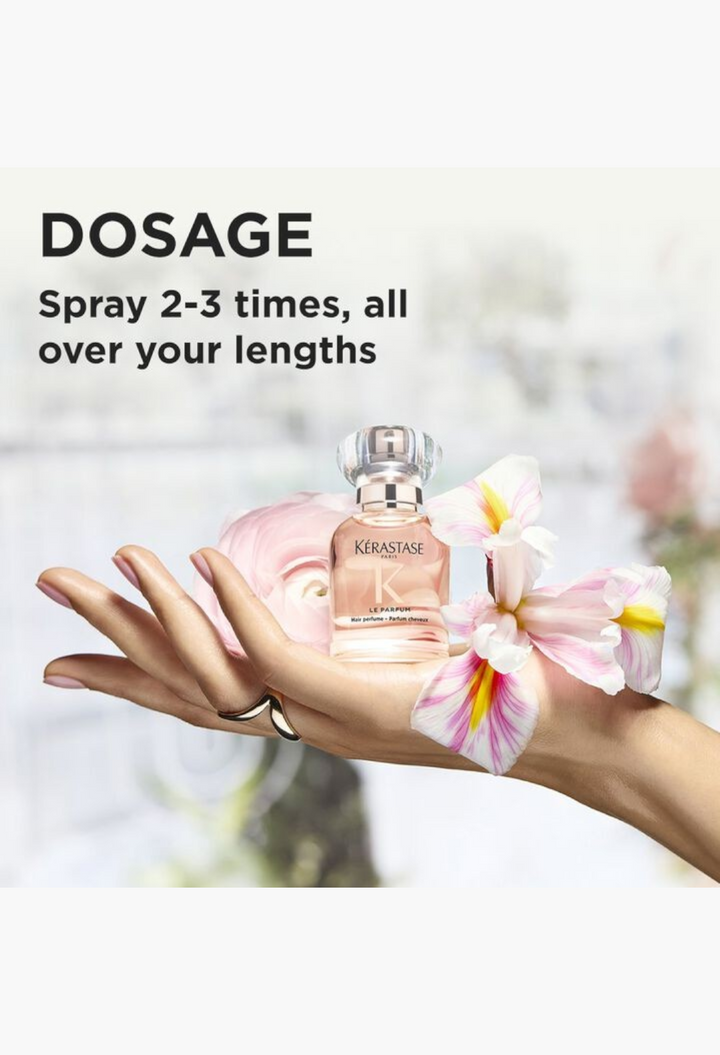 GLAM MODA Kérastase Le Parfum hair perfume bottle held in a hand with floral accents and dosage instructions