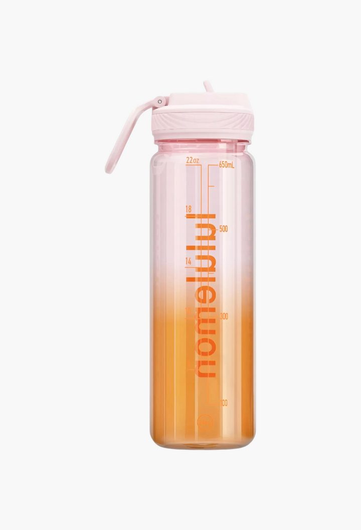 GLAM MODA 24oz clear Tritan water bottle with a pink straw lid, featuring an orange gradient and hydration markings.