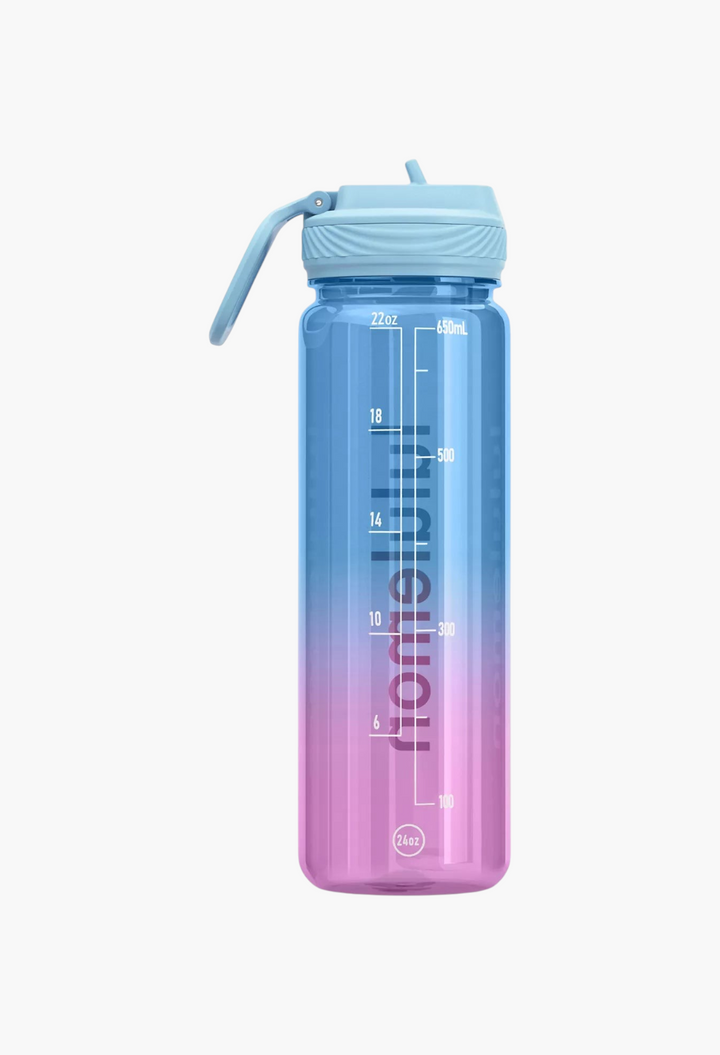 GLAM MODA 24oz clear Tritan water bottle with a blue-to-pink gradient, straw lid, and hydration measurement markings.