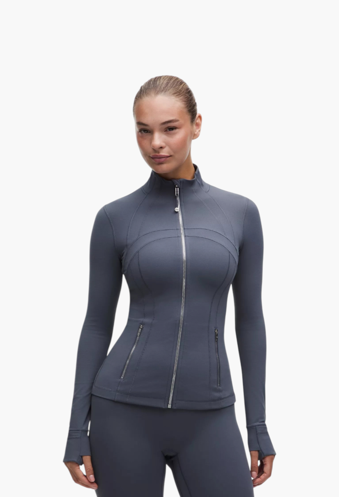 GLAM MODA Define Jacket Nulu in dark grey, featuring a slim fit, zippered pockets, and thumbholes in soft fabric.