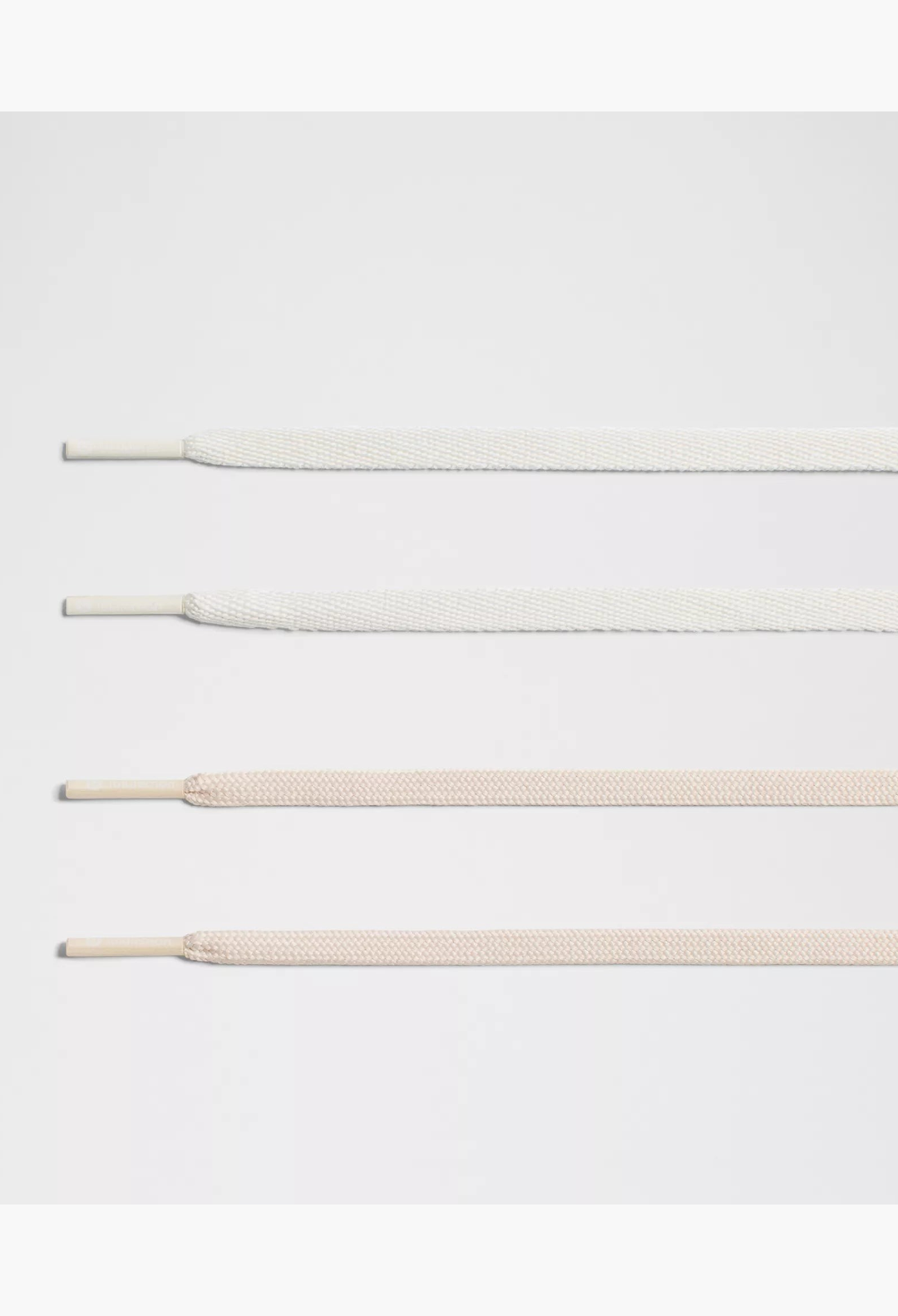 GLAM MODA Cityverse sneaker replacement laces in two neutral shades of white and beige with aglets