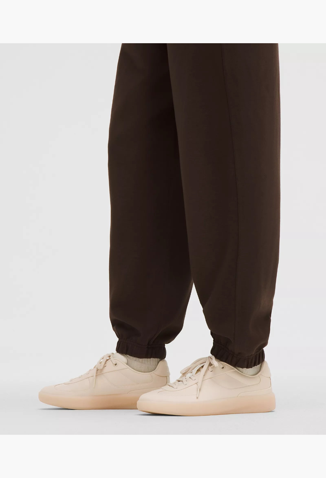 GLAM MODA Women's Cityverse sneaker in cream with leather-alternative upper, exposed stitching, and rubber outsole.