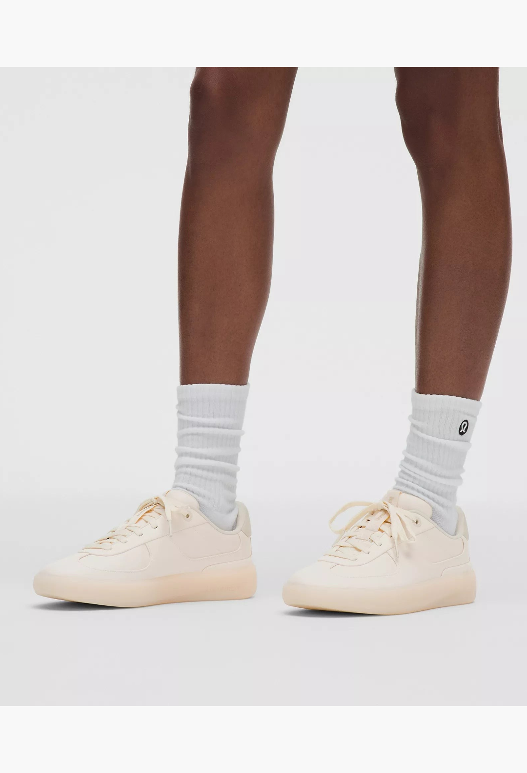 GLAM MODA Women's Cityverse sneaker in cream with leather-alternative upper, exposed stitching, and rubber outsole.