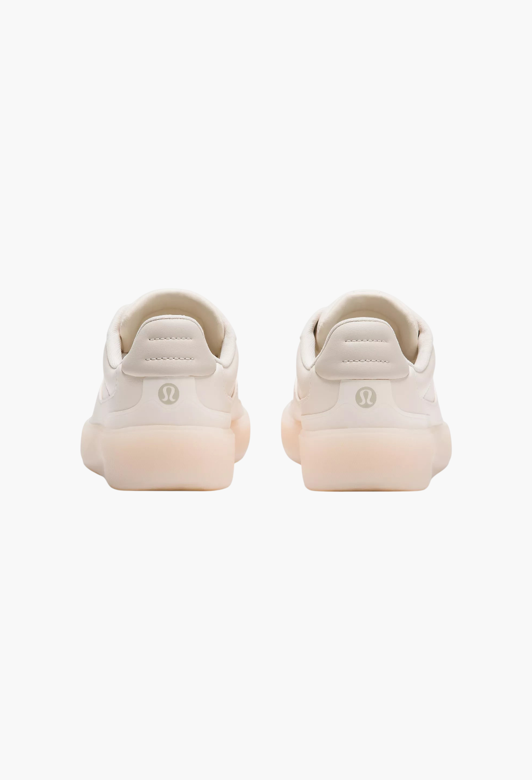 GLAM MODA Women's Cityverse sneakers in off-white, showing a rear view of the cupped rubber outsoles and heel detail.