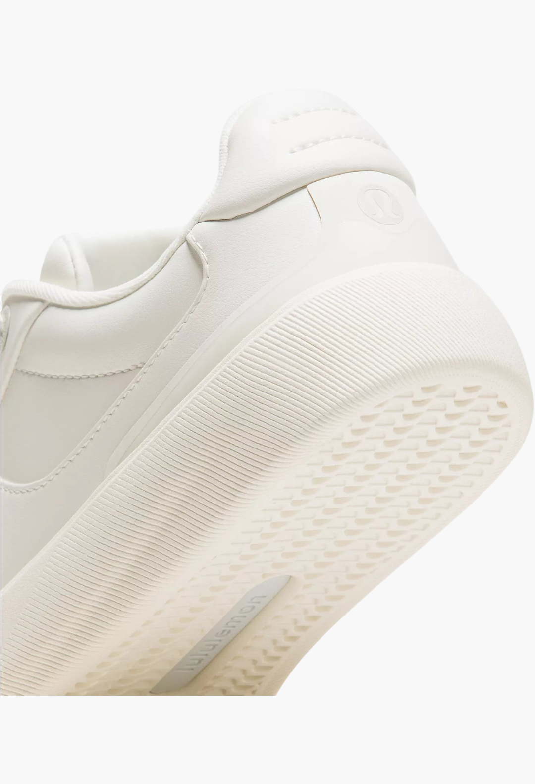 GLAM MODA Cityverse white sneaker heel detail showing textured rubber outsole and leather-alternative material