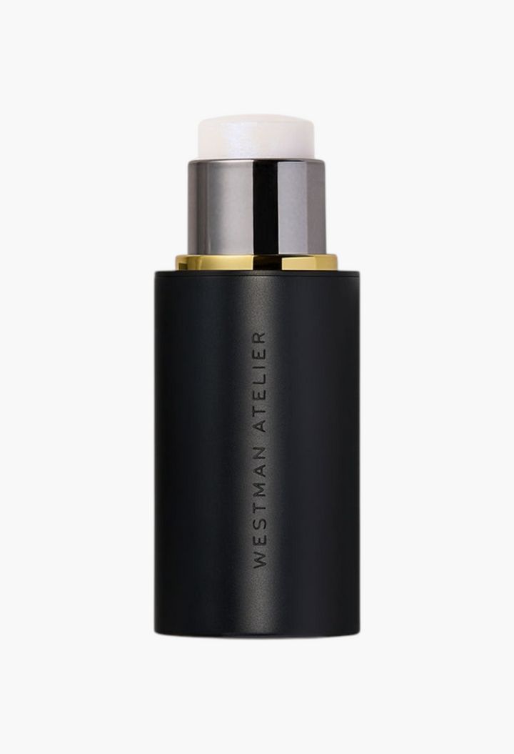 GLAM MODA Lit Up Highlight Stick in a sleek black twist-up tube for a radiant glassy finish on skin.
