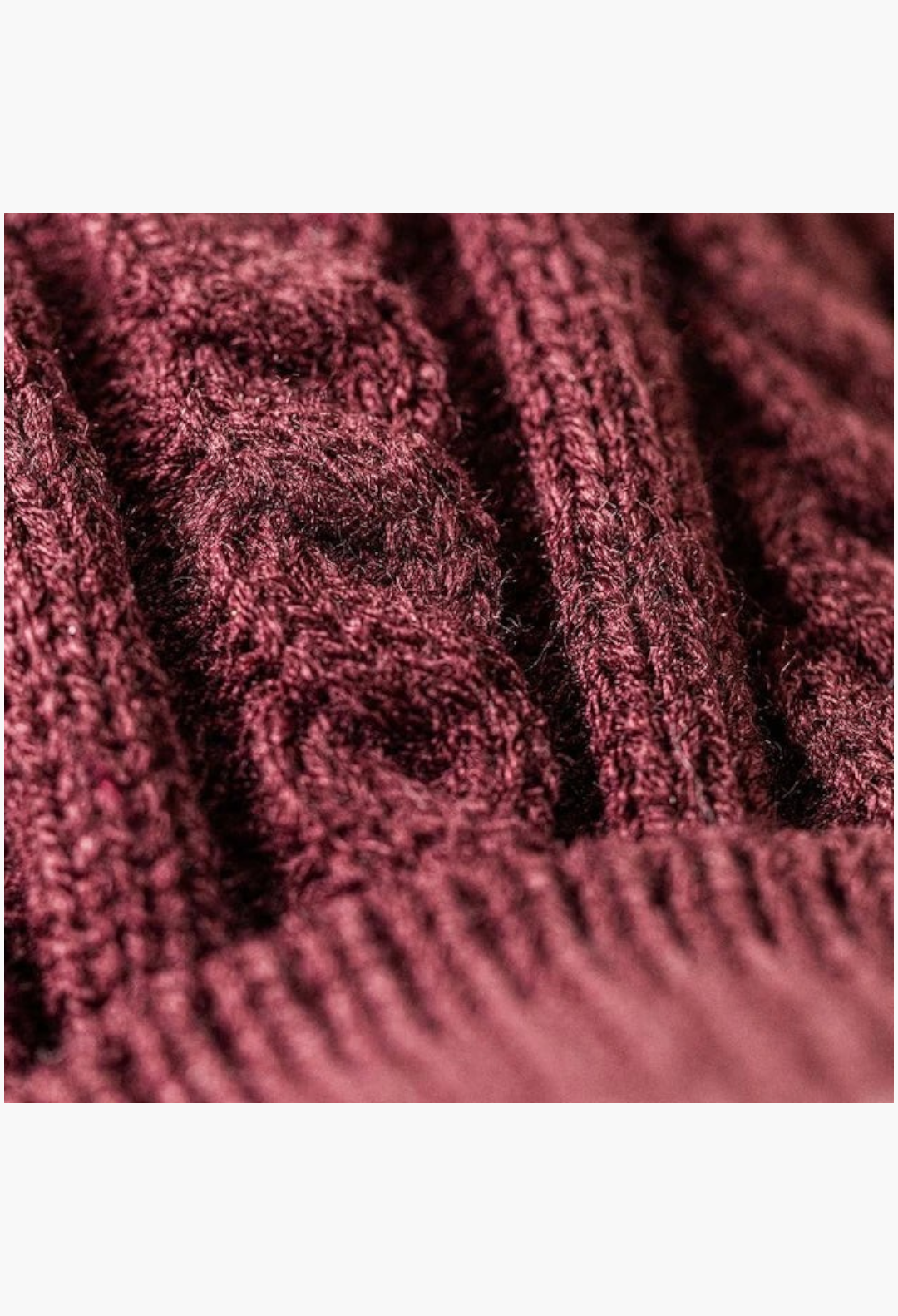 Close-up of the deep burgundy cable knit texture on the GLAM MODA Munro Scottie Dog winter jumper