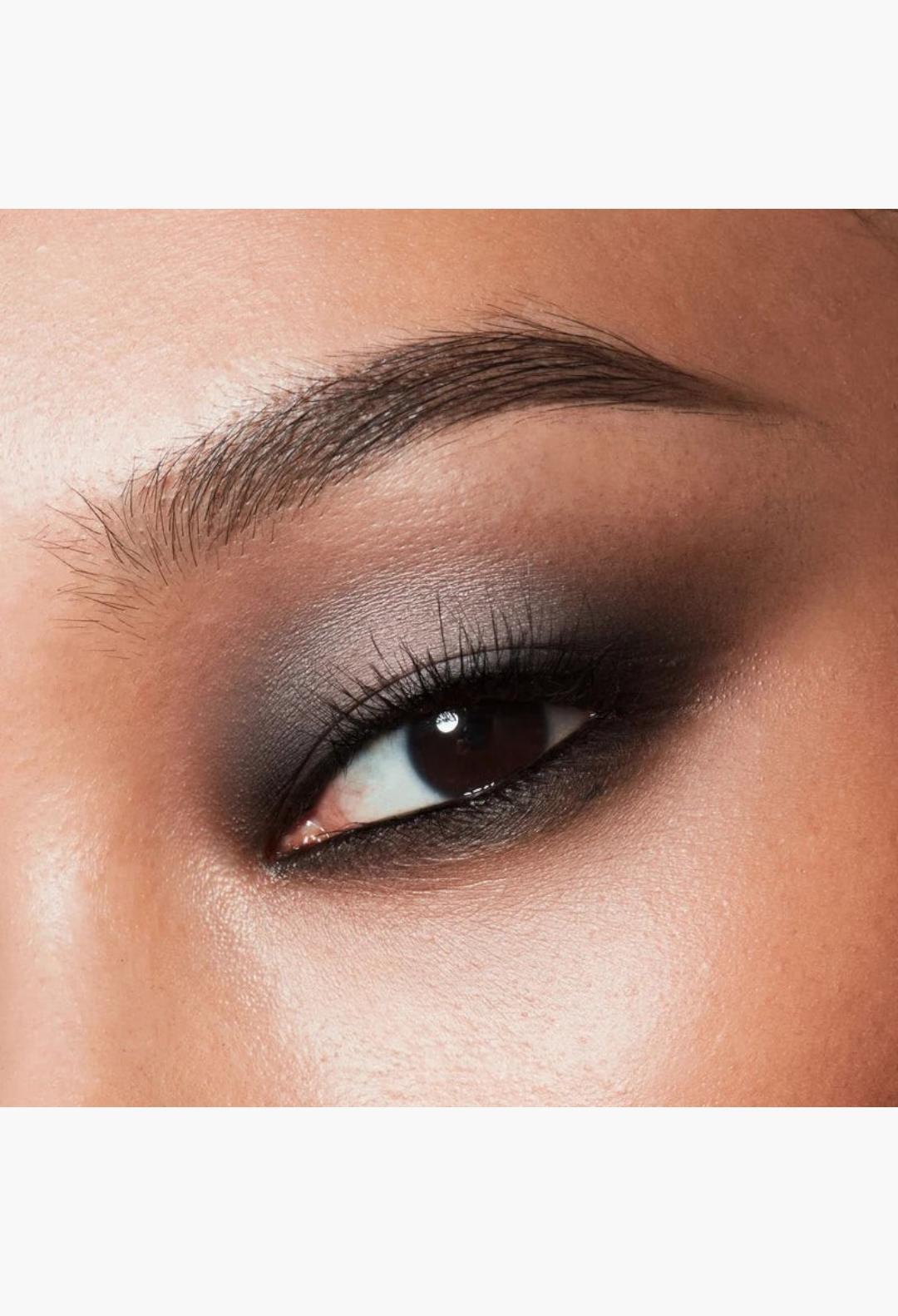 GLAM MODA Major Dimension III matte eyeshadow in smoky cool and warm nude tones applied on a model eyelid